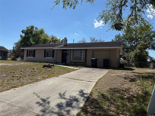 2108 Wolf Rd, Orlando, FL 32808 - ranch-style house featuring concrete driveway, an attached garage, a chimney, and fence