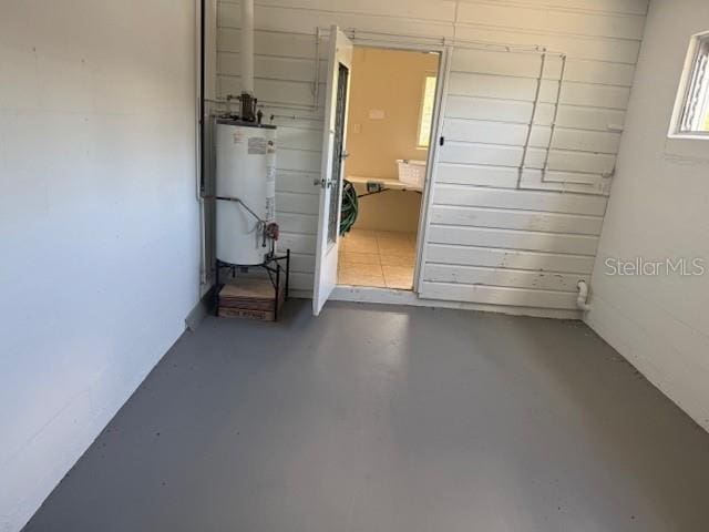 2108 Wolf Rd, Orlando, FL 32808 - garage featuring gas water heater