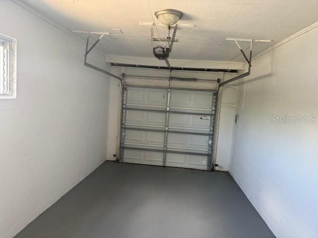 2108 Wolf Rd, Orlando, FL 32808 - garage featuring a garage door opener