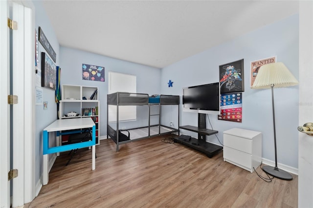 654 Chadbury Way, Kissimmee, FL 34744 - bedroom featuring baseboards and wood finished floors