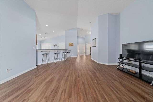 654 Chadbury Way, Kissimmee, FL 34744 - living room with baseboards, high vaulted ceiling, wood finished floors, and recessed lighting