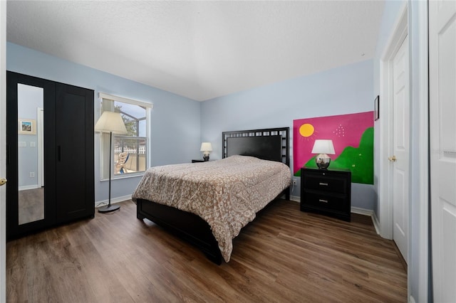 654 Chadbury Way, Kissimmee, FL 34744 - bedroom with baseboards and wood finished floors