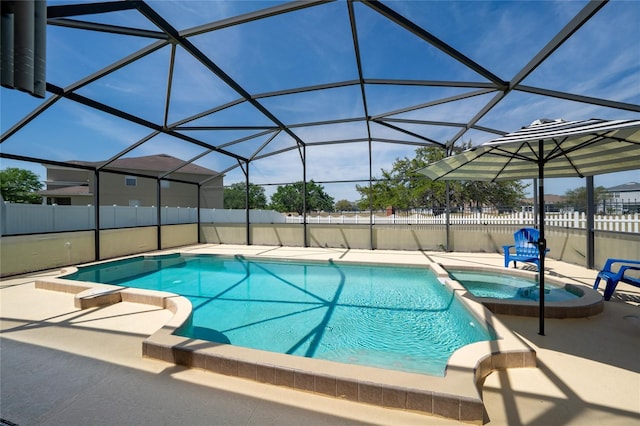 654 Chadbury Way, Kissimmee, FL 34744 - view of pool with a fenced backyard, a pool with connected hot tub, glass enclosure, and a patio