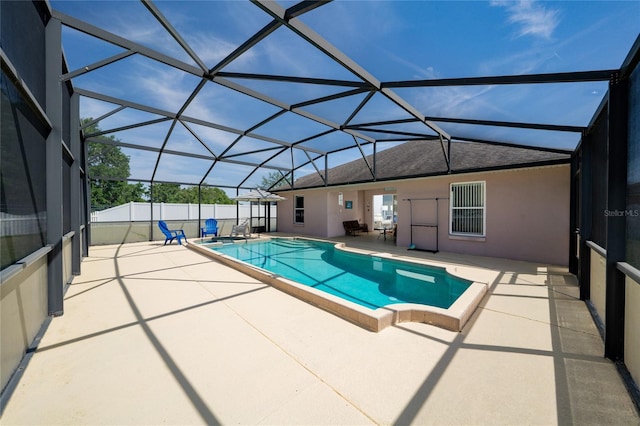 654 Chadbury Way, Kissimmee, FL 34744 - view of swimming pool featuring glass enclosure, fence, a fenced in pool, and a patio area