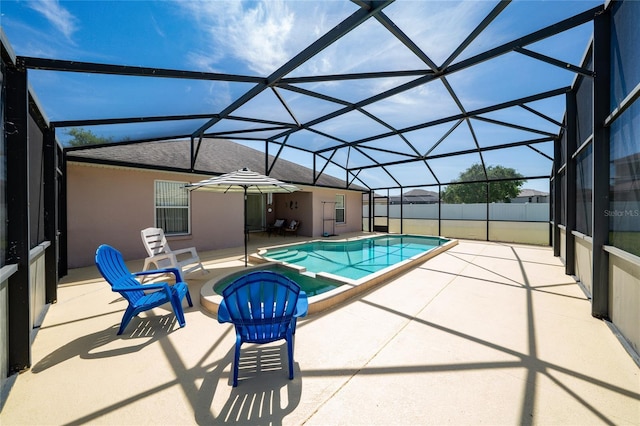 654 Chadbury Way, Kissimmee, FL 34744 - view of swimming pool with glass enclosure, fence, a pool with connected hot tub, and a patio area