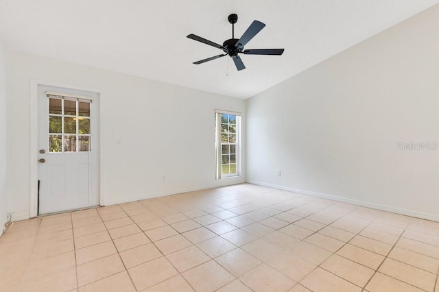 1002 Kelsey Ave, Oviedo, FL 32765 - empty room with light tile patterned flooring, baseboards, lofted ceiling, and ceiling fan