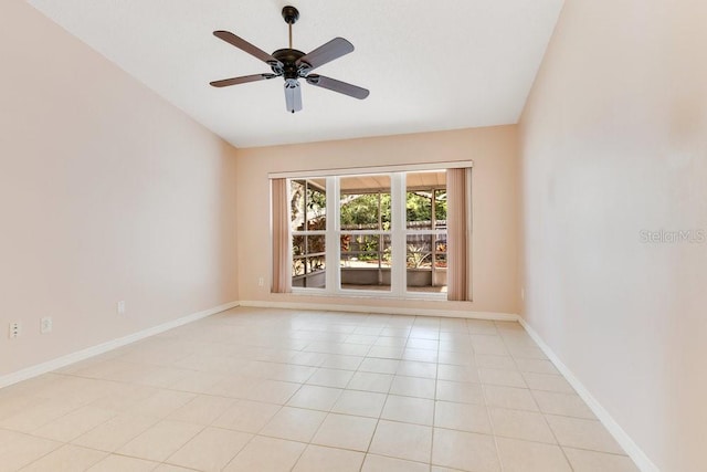 1002 Kelsey Ave, Oviedo, FL 32765 - spare room featuring baseboards, lofted ceiling, ceiling fan, and light tile patterned floors