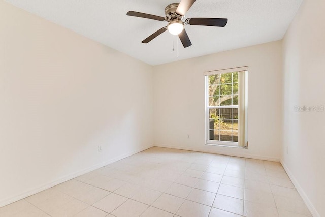 1002 Kelsey Ave, Oviedo, FL 32765 - spare room with baseboards, ceiling fan, and light tile patterned floors