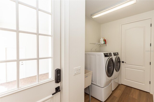 25813 Feather Ridge Ln, Sorrento, FL 32776 - laundry room featuring washing machine and clothes dryer and light wood-style flooring