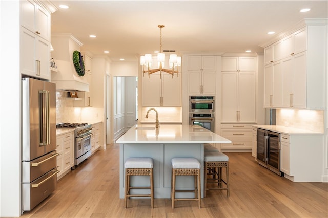 25813 Feather Ridge Ln, Sorrento, FL 32776 - kitchen with premium appliances, beverage cooler, decorative backsplash, and recessed lighting