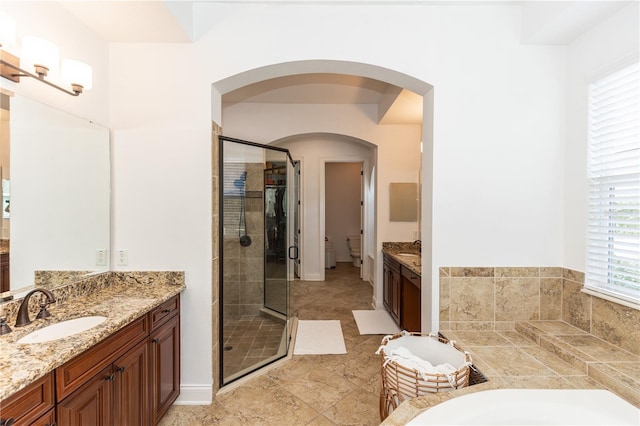 25813 Feather Ridge Ln, Sorrento, FL 32776 - full bath with a shower stall, two vanities, and a garden tub