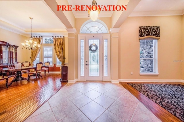 25813 Feather Ridge Ln, Sorrento, FL 32776 - tiled entrance foyer with a chandelier and crown molding