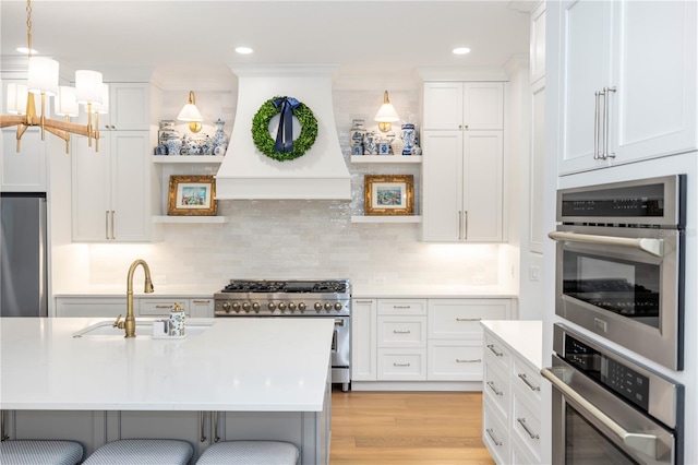 25813 Feather Ridge Ln, Sorrento, FL 32776 - kitchen featuring stainless steel appliances, custom exhaust hood, light countertops, white cabinets, and backsplash