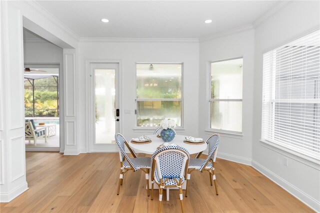 25813 Feather Ridge Ln, Sorrento, FL 32776 - dining room featuring light wood-type flooring, crown molding, and recessed lighting