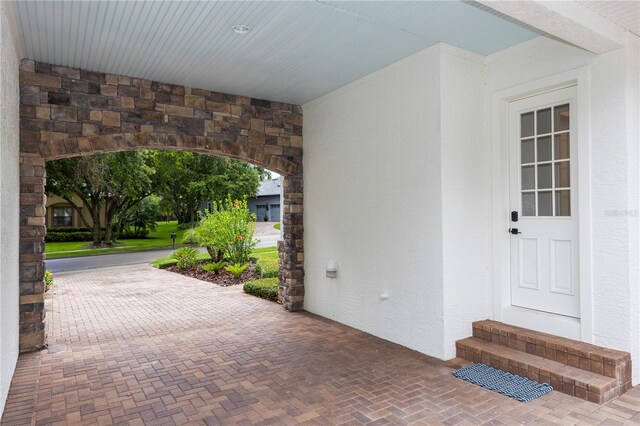 25813 Feather Ridge Ln, Sorrento, FL 32776 - doorway to property with stucco siding and stone siding
