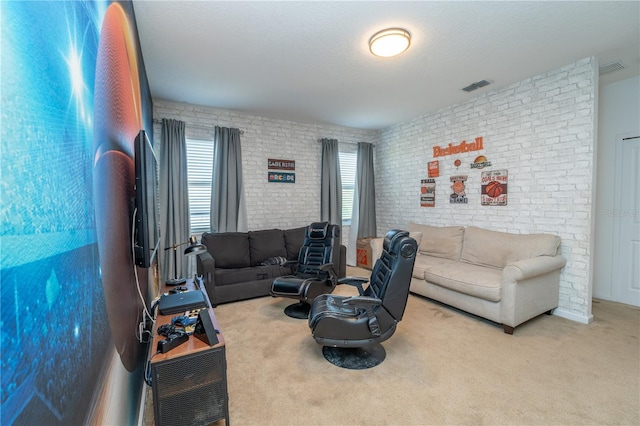 2659 Calistoga Ave, Kissimmee, FL 34741 - living area featuring brick wall, visible vents, and carpet floors