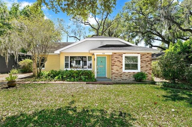 926 Mayfair Cir, Orlando, FL 32803 - view of front facade with brick siding and a front lawn