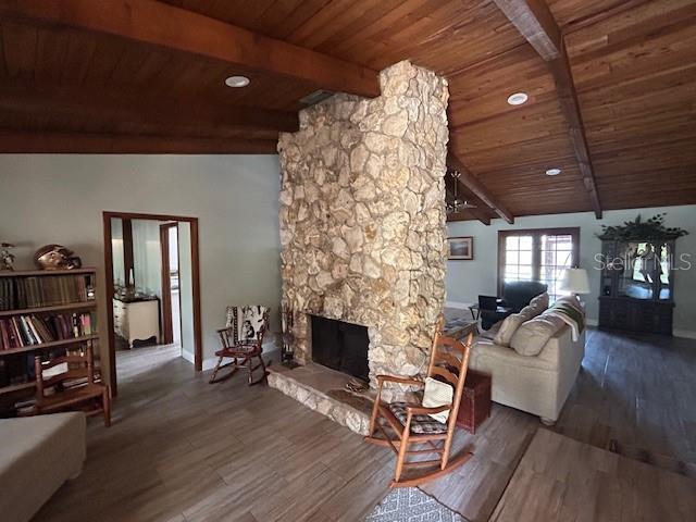 1500 Markham Woods Rd, Longwood, FL 32779 - living room featuring a fireplace, wood finished floors, and wooden ceiling