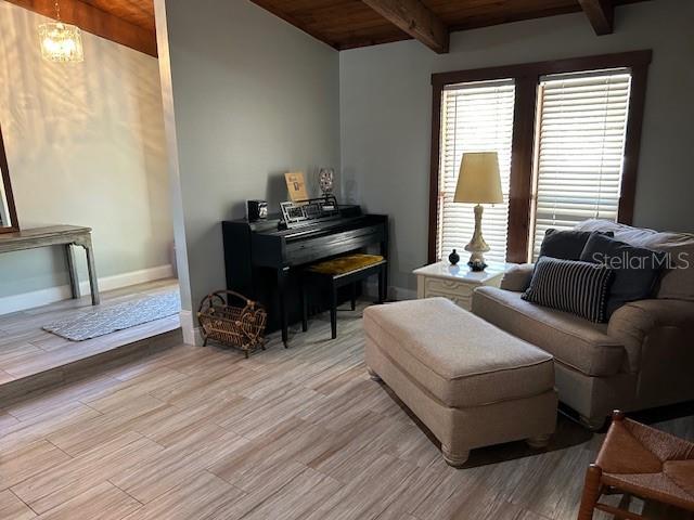 1500 Markham Woods Rd, Longwood, FL 32779 - living area featuring baseboards, light wood-style flooring, wooden ceiling, and beam ceiling