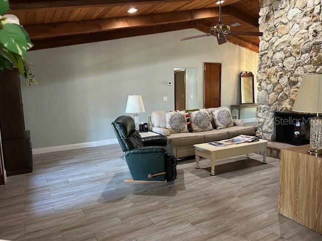 1500 Markham Woods Rd, Longwood, FL 32779 - living room featuring lofted ceiling with beams, baseboards, wood ceiling, ceiling fan, and wood finished floors