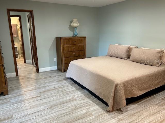 1500 Markham Woods Rd, Longwood, FL 32779 - bedroom with baseboards and light wood-style floors