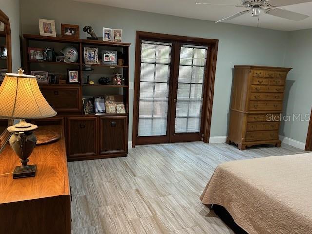 1500 Markham Woods Rd, Longwood, FL 32779 - bedroom with baseboards, ceiling fan, and light wood-type flooring