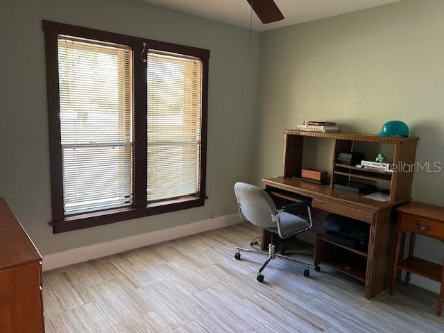 1500 Markham Woods Rd, Longwood, FL 32779 - home office with baseboards and a ceiling fan
