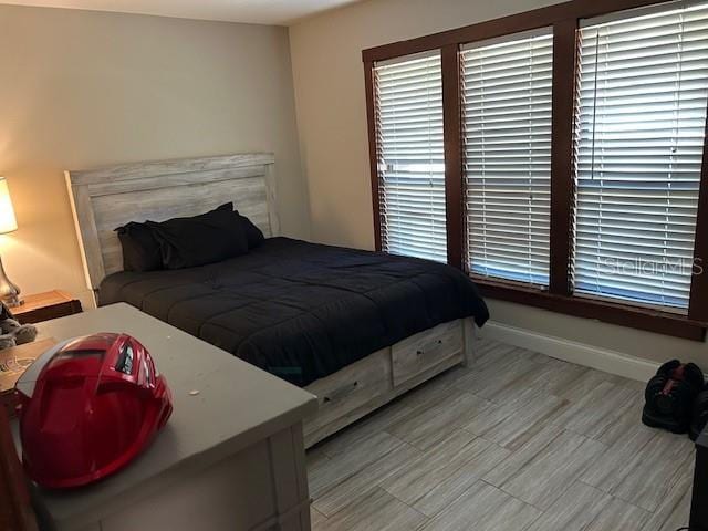 1500 Markham Woods Rd, Longwood, FL 32779 - bedroom with baseboards and light wood-style flooring