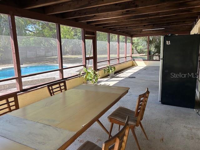 1500 Markham Woods Rd, Longwood, FL 32779 - unfurnished sunroom featuring outdoor dining area