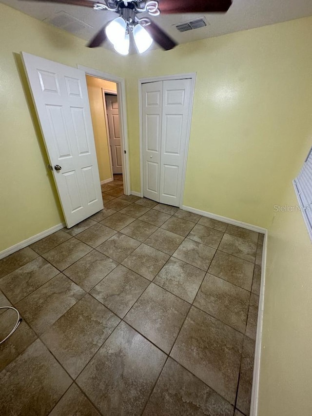 6427 Breezewood St, Orlando, FL 32818 - unfurnished bedroom featuring baseboards, ceiling fan, visible vents, and a closet
