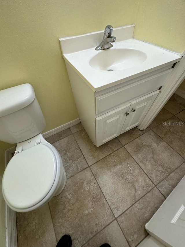 6427 Breezewood St, Orlando, FL 32818 - bathroom featuring baseboards, toilet, and vanity