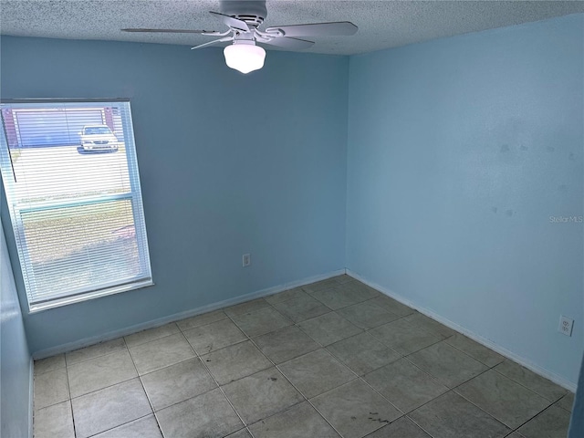 214 Magellan Dr, Kissimmee, FL 34758 - empty room featuring baseboards, a textured ceiling, and a ceiling fan