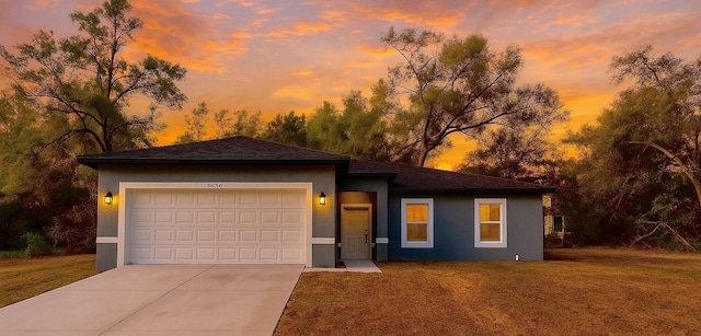 8830 N Salina Dr, Citrus Springs, FL 34434 - view of front of home featuring concrete driveway, a front lawn, an attached garage, and stucco siding