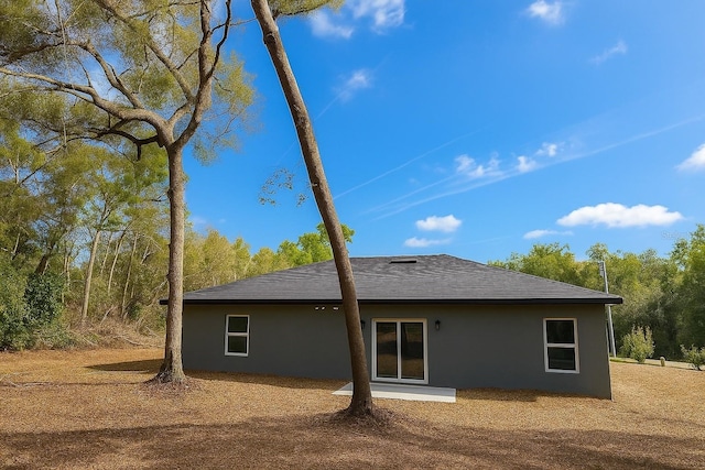8830 N Salina Dr, Citrus Springs, FL 34434 - back of property with stucco siding and roof with shingles