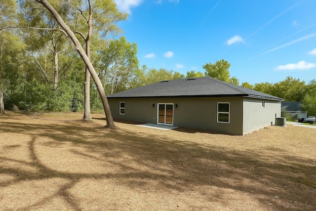 8830 N Salina Dr, Citrus Springs, FL 34434 - back of house featuring stucco siding