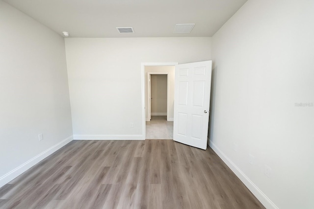 8830 N Salina Dr, Citrus Springs, FL 34434 - spare room with wood finished floors and baseboards