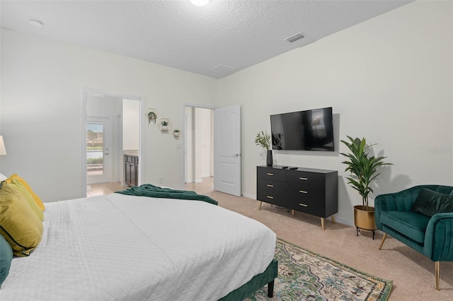 bedroom featuring light carpet, baseboards, visible vents, and a textured ceiling