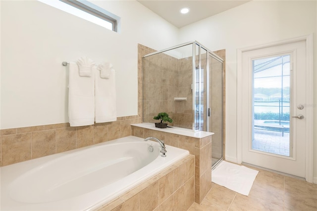 full bathroom with tile patterned floors, a garden tub, and a shower stall