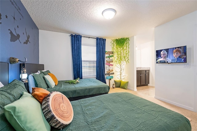 bedroom with baseboards, a textured ceiling, connected bathroom, and light colored carpet