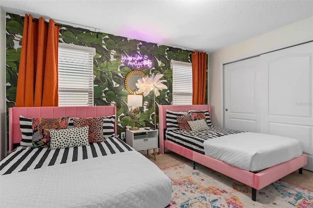 bedroom featuring a closet and a textured ceiling