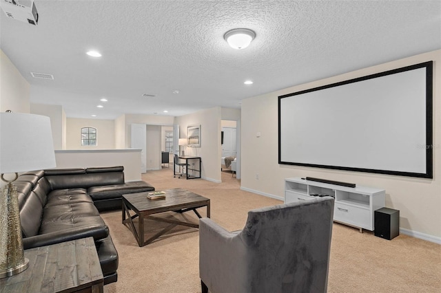 home theater room with a textured ceiling, baseboards, light colored carpet, visible vents, and recessed lighting