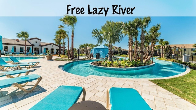 community pool featuring a patio area