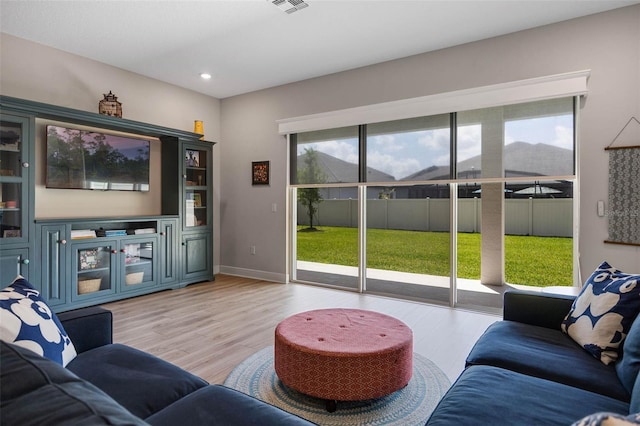 2011 Soaring Oak Way, Winter Park, FL 32792 - living area featuring baseboards, recessed lighting, and light wood-type flooring