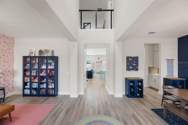 2011 Soaring Oak Way, Winter Park, FL 32792 - entryway with baseboards, light wood-type flooring, and visible vents