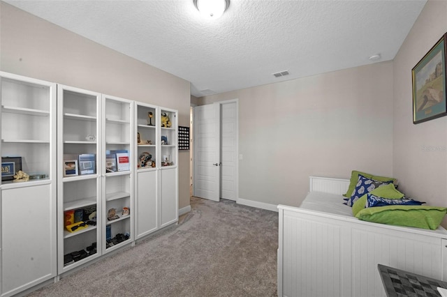 2011 Soaring Oak Way, Winter Park, FL 32792 - bedroom with a textured ceiling, baseboards, visible vents, and carpet floors