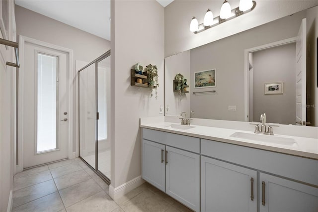 2011 Soaring Oak Way, Winter Park, FL 32792 - full bath featuring a stall shower, tile patterned flooring, double vanity, and a sink