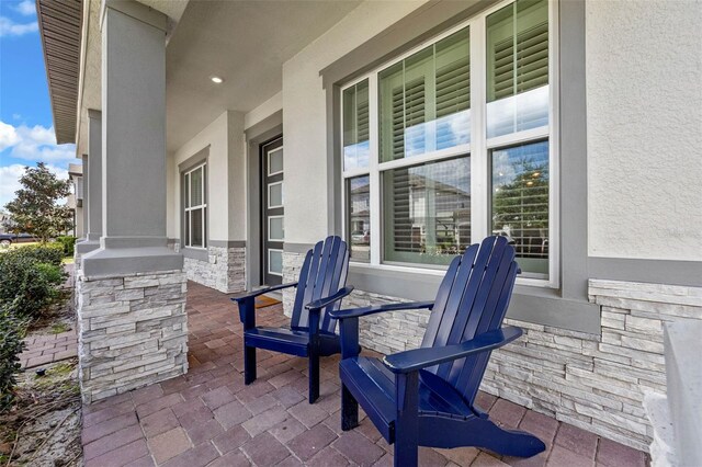 2011 Soaring Oak Way, Winter Park, FL 32792 - view of patio with covered porch