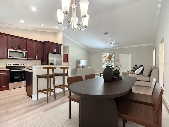 509 Mulberry St, Fruitland Park, FL 34731 - dining room with crown molding, lofted ceiling, light wood finished floors, and visible vents