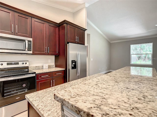 509 Mulberry St, Fruitland Park, FL 34731 - kitchen with reddish brown cabinets, ornamental molding, light stone countertops, and appliances with stainless steel finishes