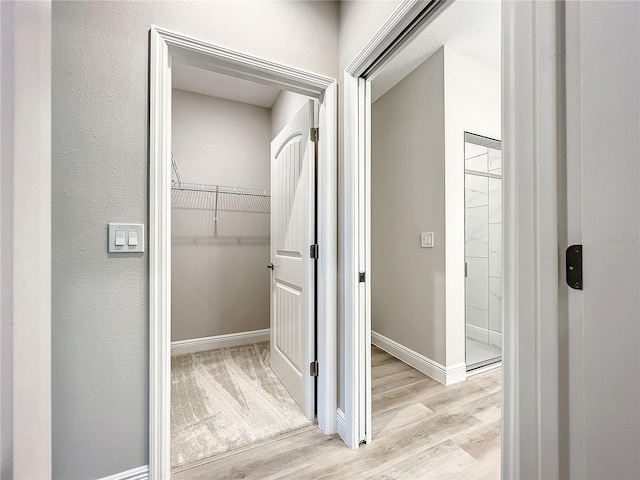 509 Mulberry St, Fruitland Park, FL 34731 - hallway featuring baseboards and light wood-style flooring
